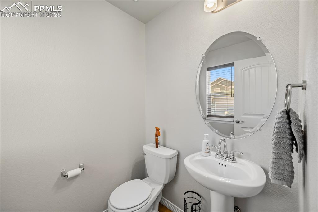 Image 5 of 33: Bathroom featuring a textured wall