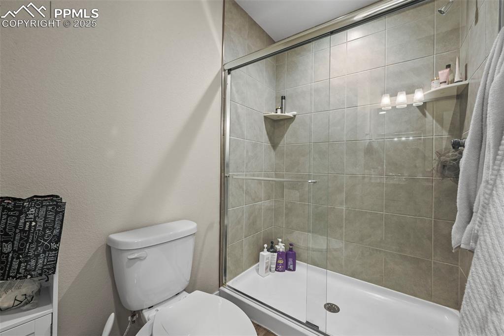 Image 17 of 44: Bathroom featuring a shower stall