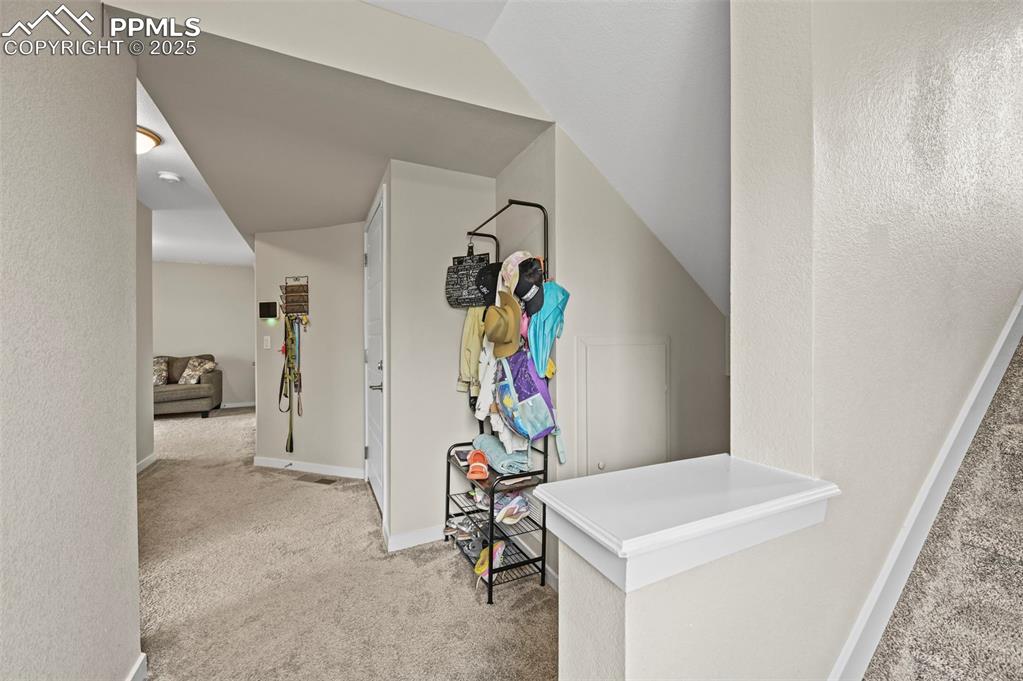 Image 26 of 44: Hallway featuring carpet flooring and baseboards