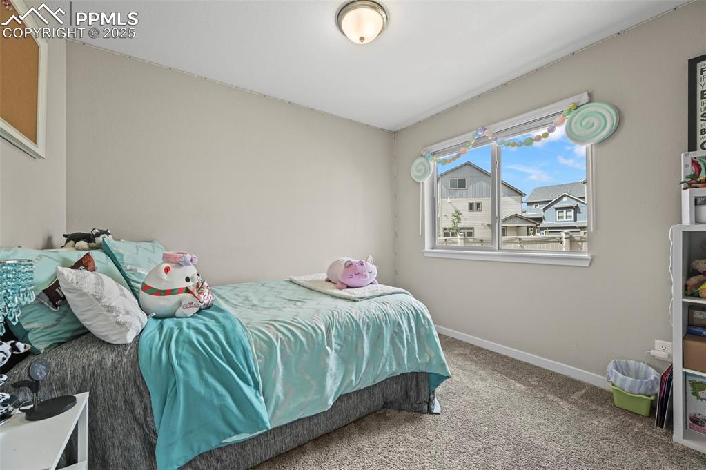 Image 30 of 44: Bedroom featuring carpet and baseboards