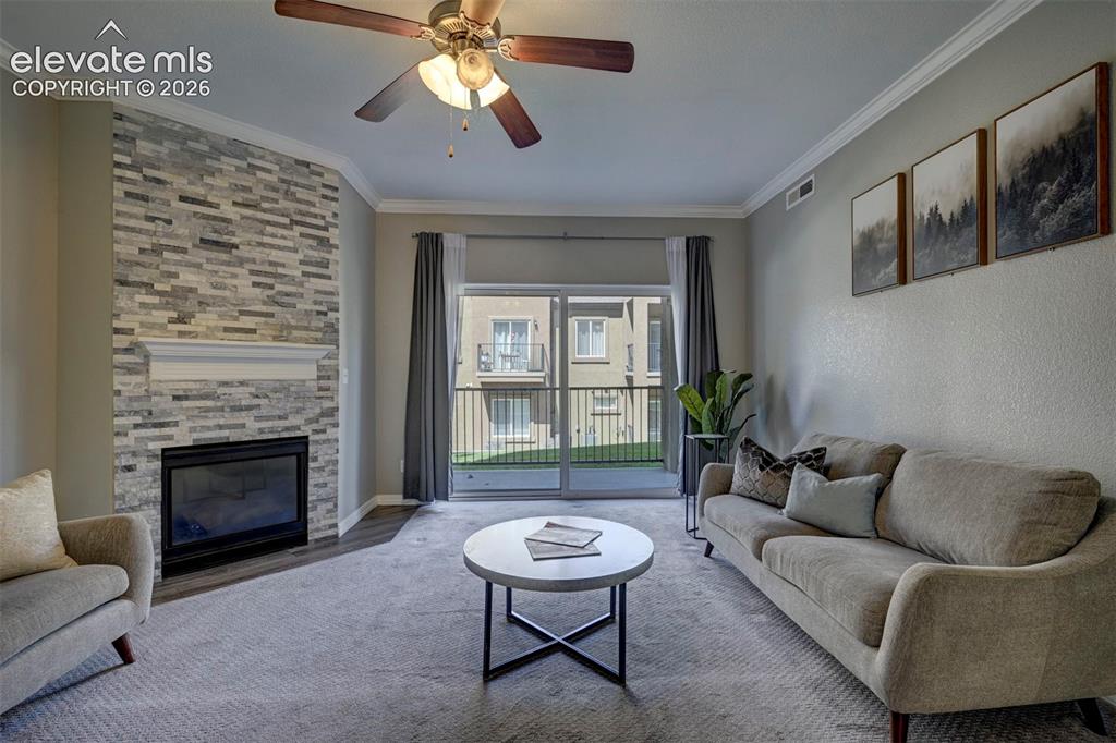 Image 11 of 40: Gas Fireplace and Walkout to private patio