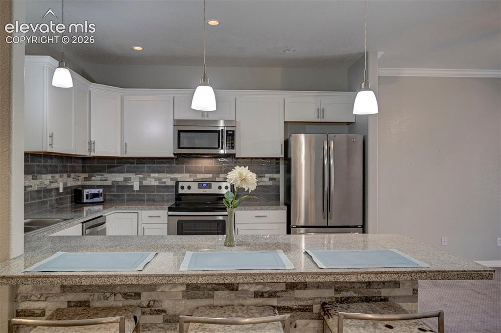 Image 5 of 40: Stacked Stone breakfast bar