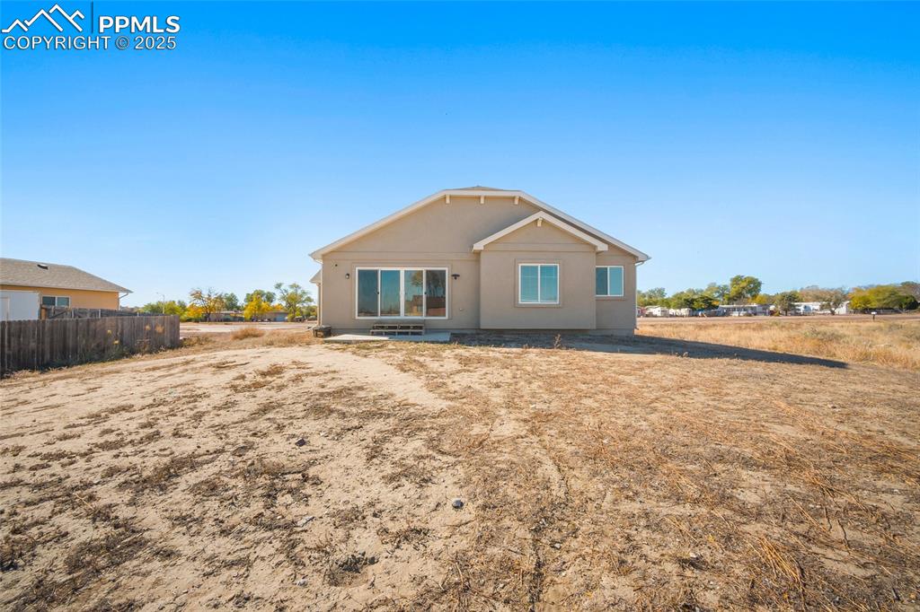 Image 9 of 30: Back of house with a patio