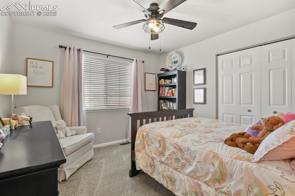 Image 31 of 40: Bedroom with carpet, a ceiling fan, and a closet