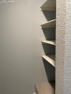 Image 18 of 28: Extra shelving by the master bedroom closet