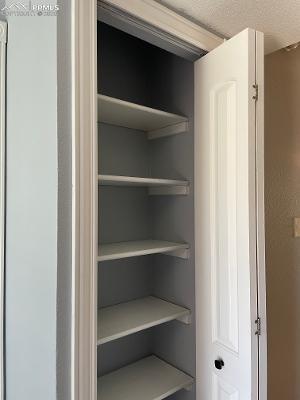 Image 22 of 28: Linen closet outside of upstairs bathroom