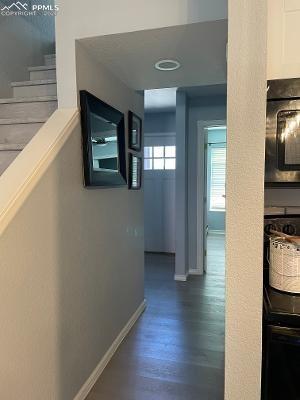 Image 7 of 28: The view from the kitchen to the front door