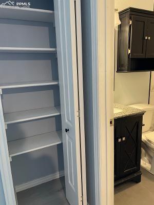 Image 8 of 28: Nice pantry right beside the kitchen