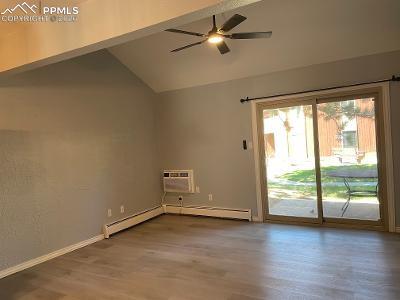 Image 9 of 28: Living Room with beamed cathedral ceiling, luxury flooring, and ceiling fan