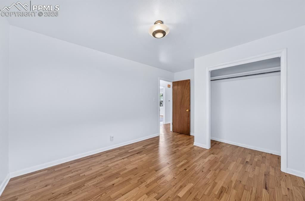 Image 31 of 46: White soaking tub with chrome fixtures, surrounded by light brown tile