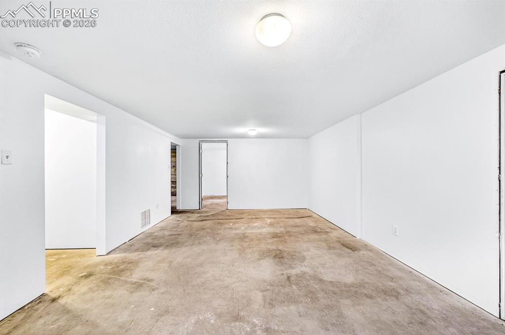 Image 37 of 46: Contemporary vanity with a flat-panel white countertop and integrated sink,