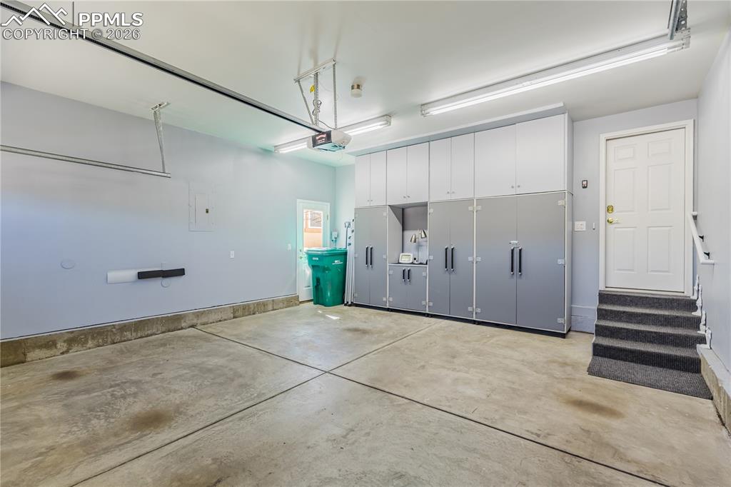 Image 30 of 32: FULLY FINISHED GARAGE