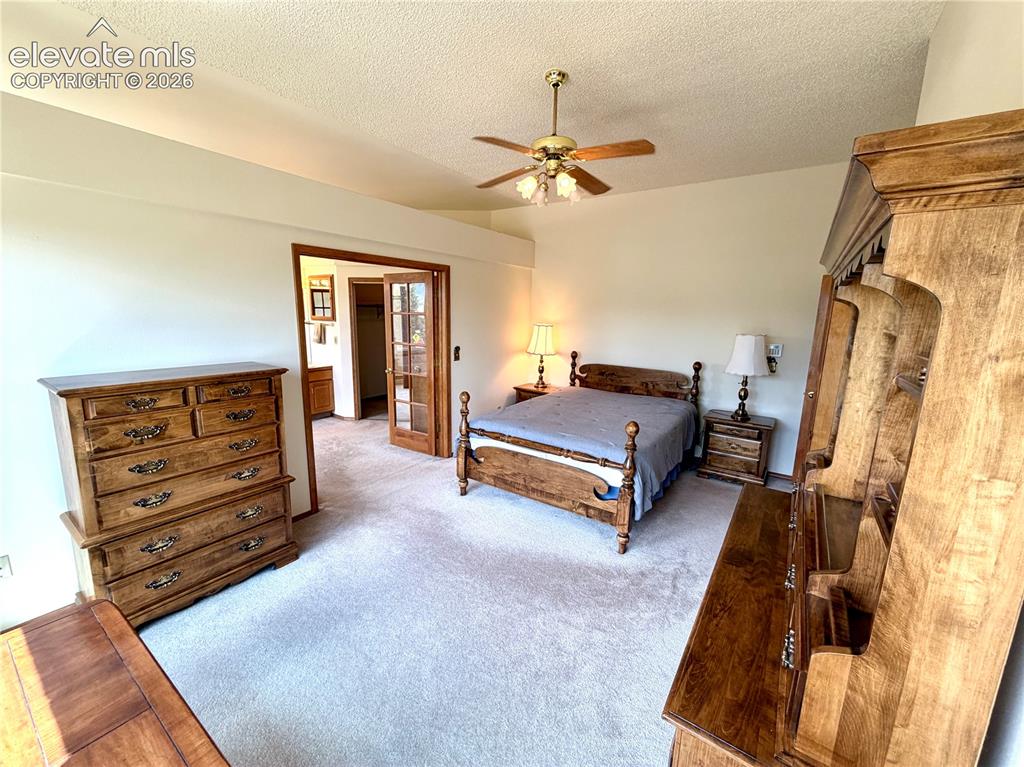 Image 21 of 50: Carpeted interior space featuring light-colored walls and a textured ceilin