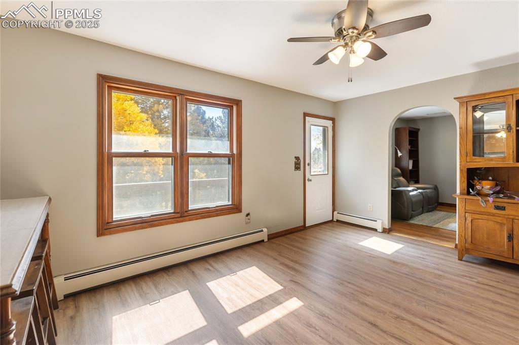 Image 18 of 50: Main level breakfast/dining area, walk out to upper deck, new LVP flooring 