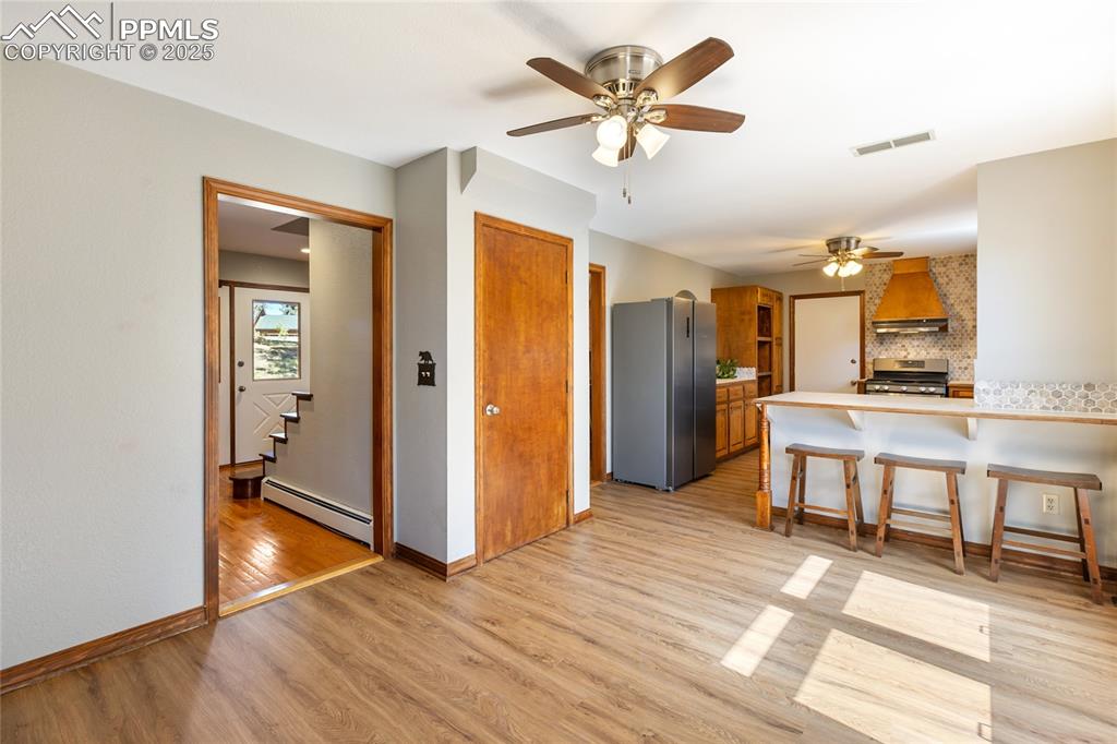 Image 19 of 50: Main level kitchen/breakfast area/entry, new LVP flooring