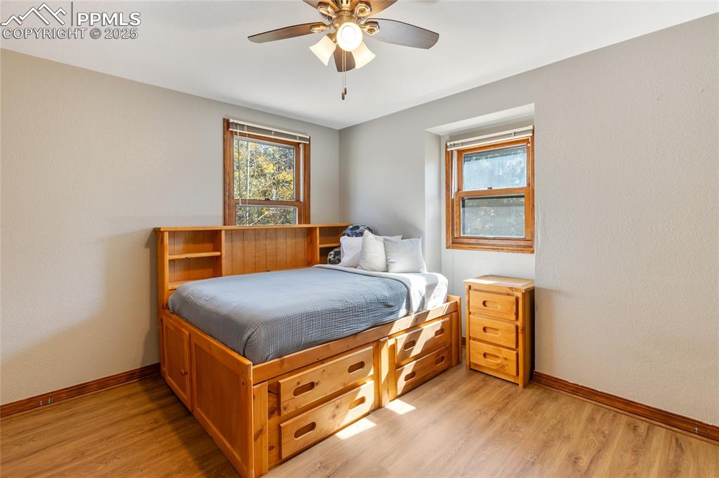 Image 26 of 50: Upper bedroom #2 with LVP flooring