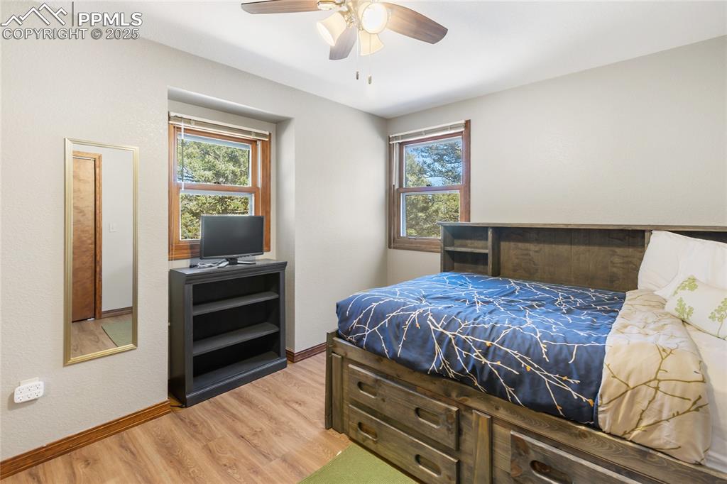 Image 28 of 50: Upper level bedroom #3 with LVP flooring