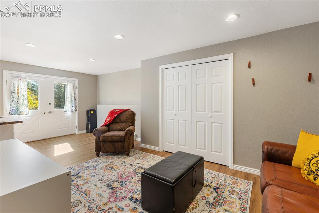 Image 40 of 50: Basement level family room with walk out and wet bar