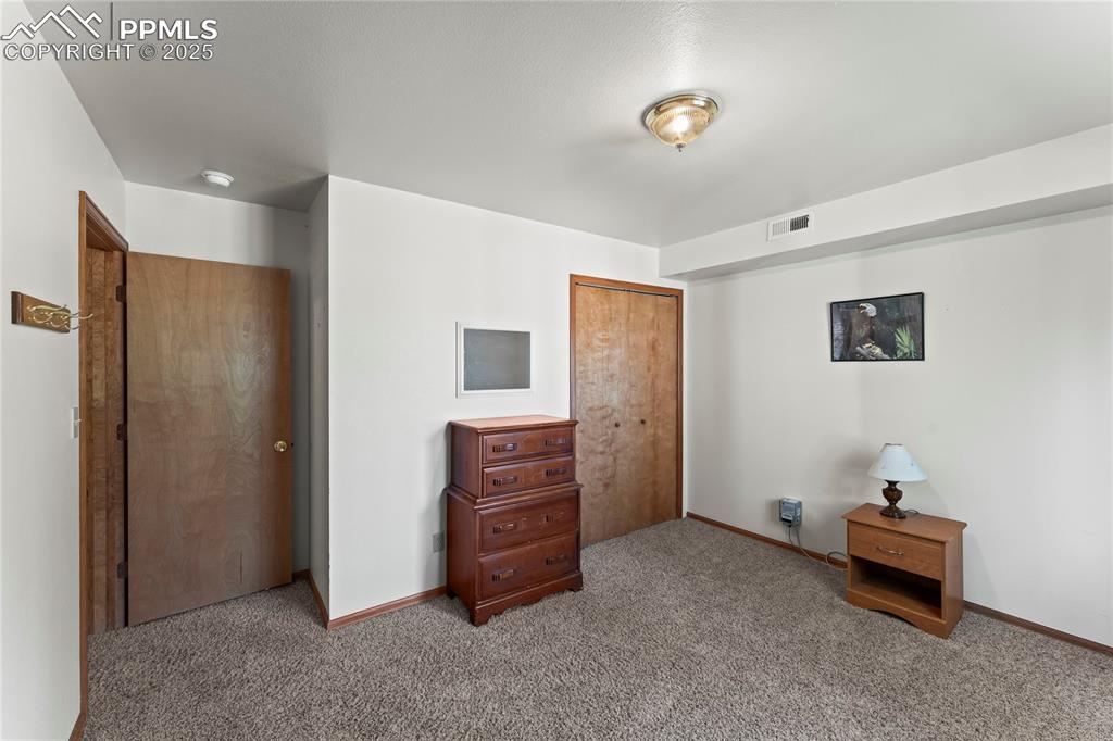 Image 30 of 36: 3rd Bedroom featuring a closet and light carpet