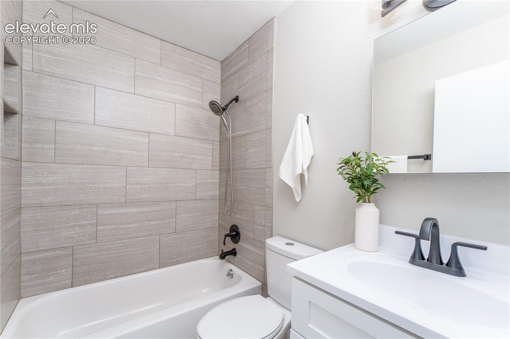 Image 14 of 38: Hallway Bathroom
