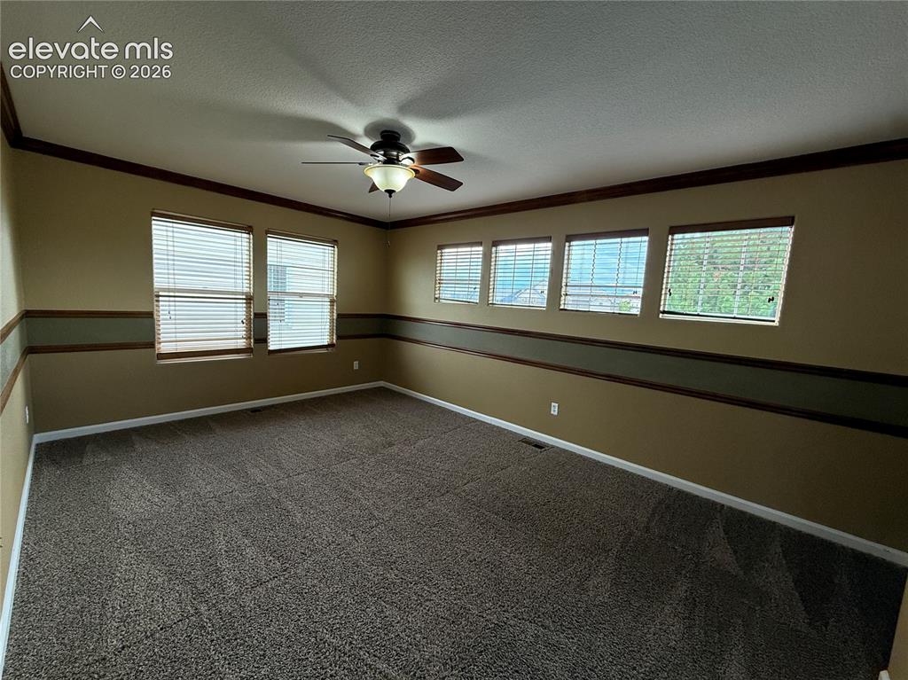 Image 18 of 28: Recessed ceiling fan with integrated lighting, multiple windows with blinds