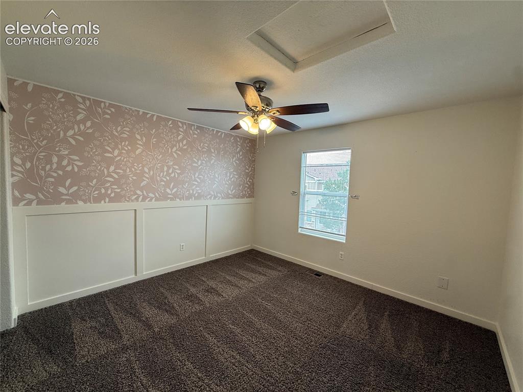 Image 28 of 28: Angled ceiling with a ceiling fan light fixture