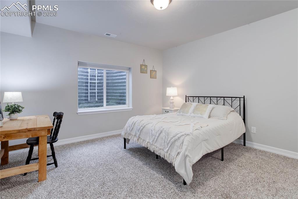 Image 24 of 38: Bedroom 4 w/ en-suite bath - lower level