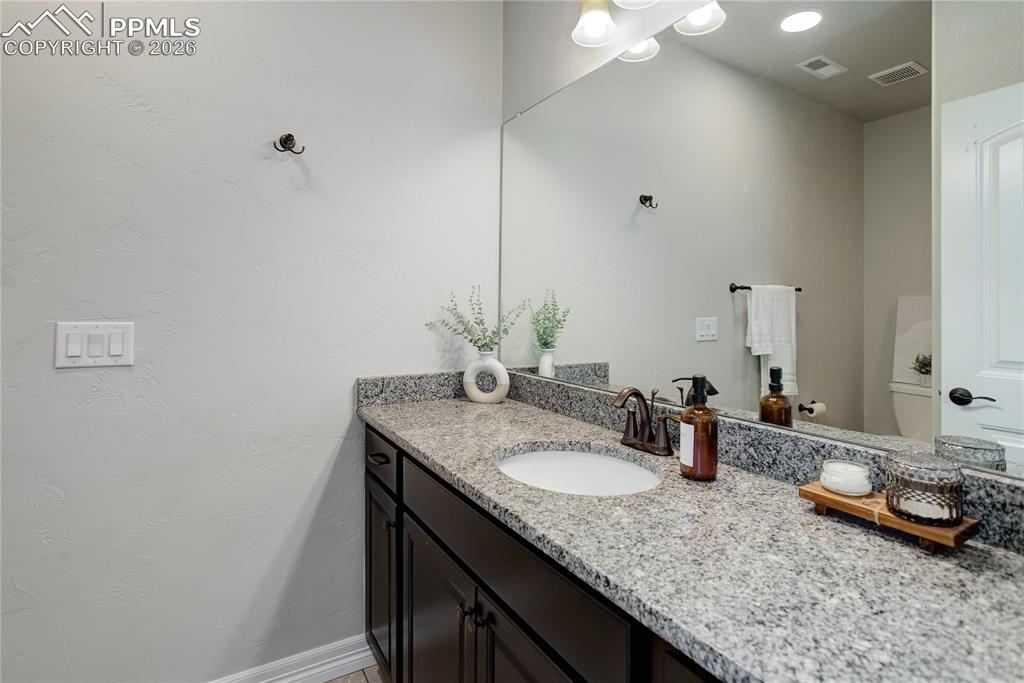 Image 25 of 38: Full bath attached to Bedroom 4