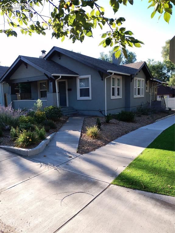 Image 2 of 30: View of front facade featuring stucco siding