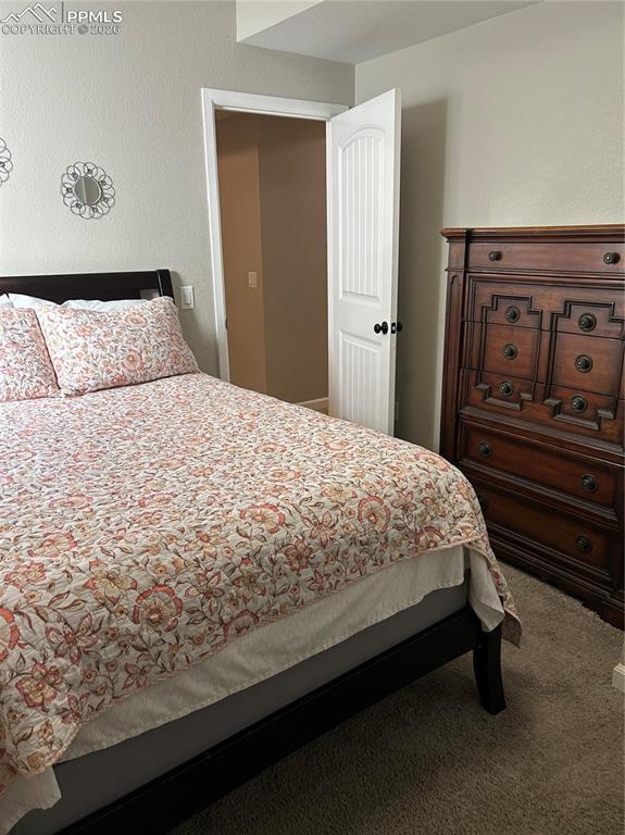 Image 20 of 30: Carpeted bedroom lower level bedroom #2