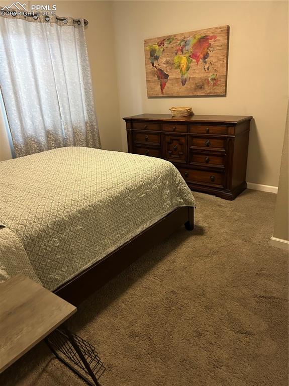 Image 27 of 30: Carpeted lower level bedroom # 1