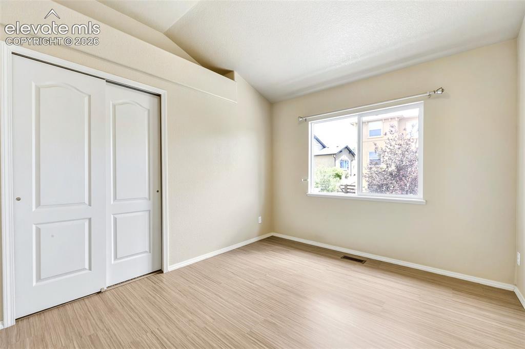 Image 24 of 34: Second vaulted upper bedroom
