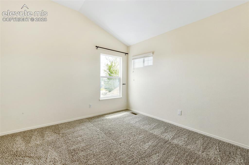 Image 26 of 34: 3rd upper vaulted bedroom has views!