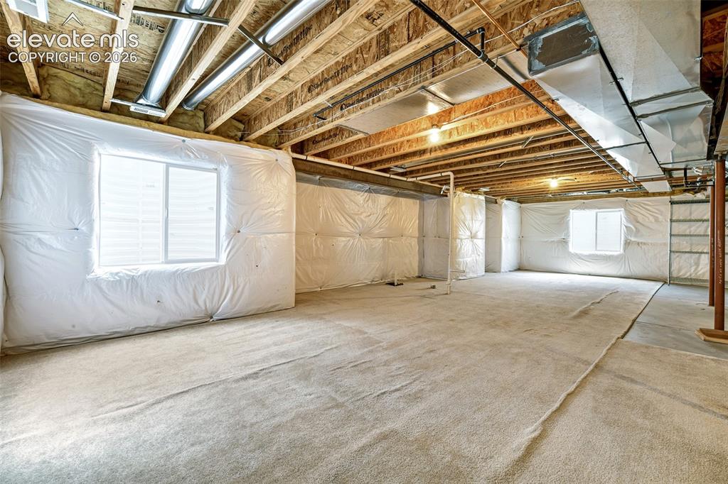 Image 28 of 34: Massive basement for future renovation and expansion!