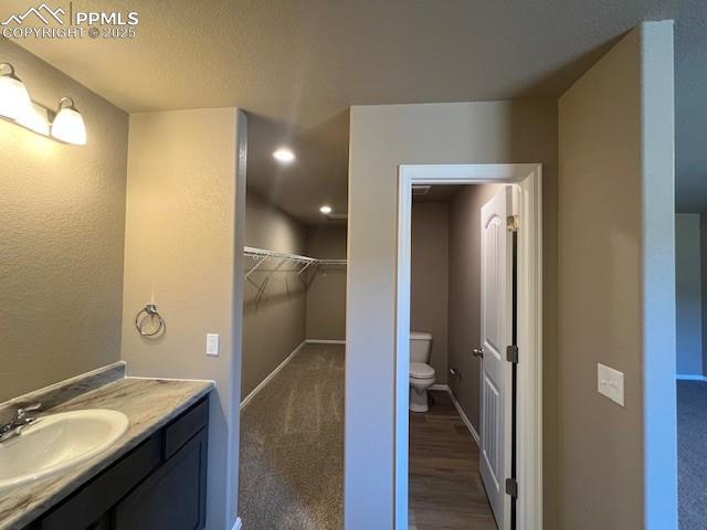Image 12 of 22: Bathroom with vanity and toilet