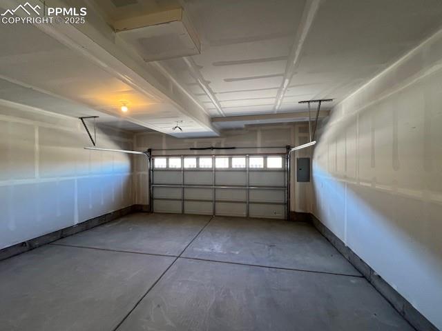 Image 21 of 22: Garage featuring electric panel