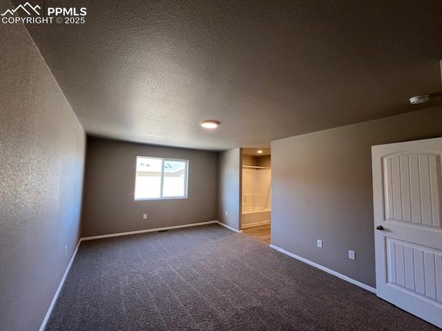 Image 9 of 22: Carpeted empty room featuring a textured ceiling