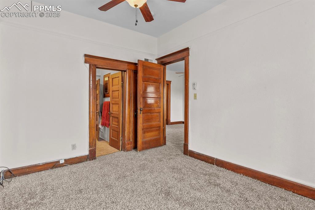 Image 15 of 30: Carpeted spare room with baseboards