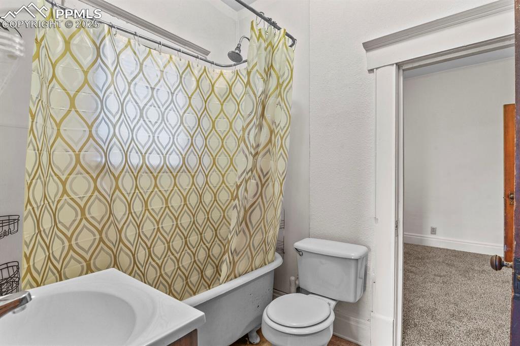 Image 19 of 30: Bathroom with toilet and vanity