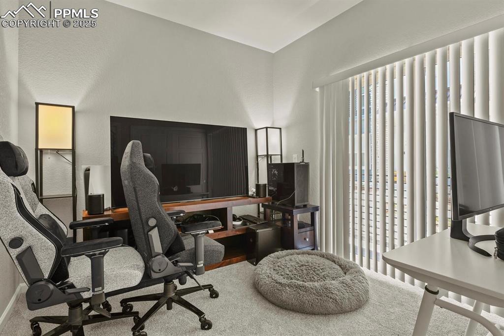 Image 5 of 22: Downstairs bedroom with private bath.