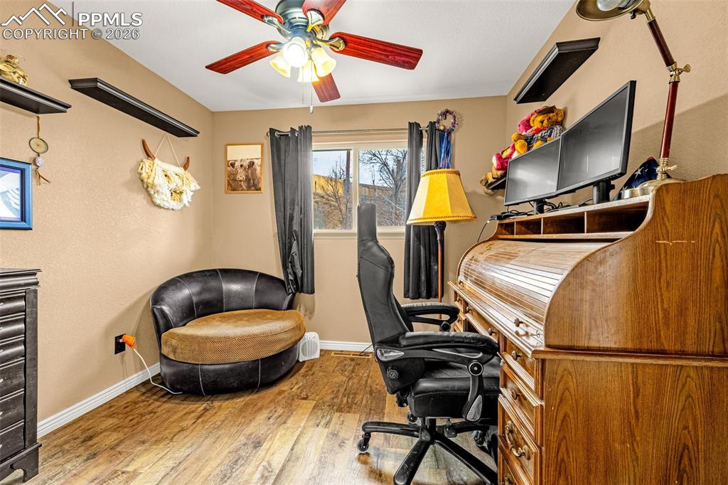 Image 21 of 29: Home office with hardwood / wood-style flooring and ceiling fan