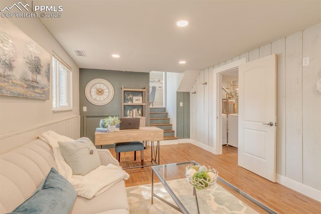 Image 11 of 47: Den with LVP flooring