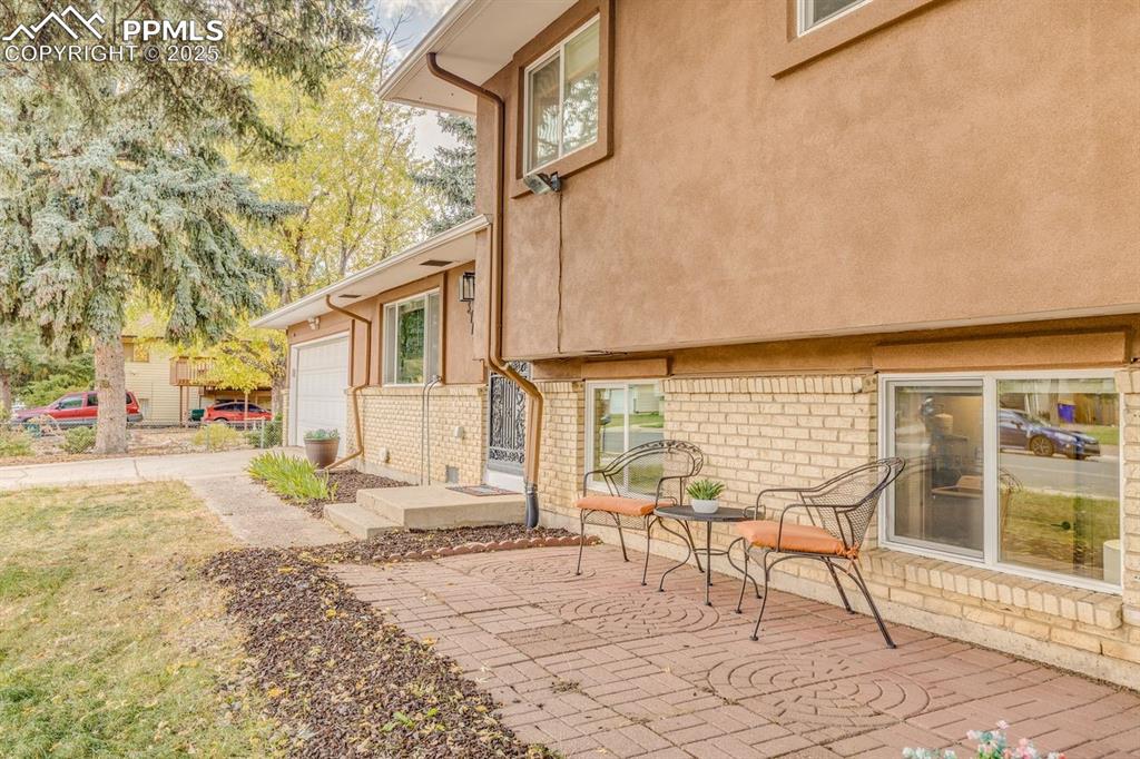 Image 16 of 47: View of patio / terrace featuring driveway
