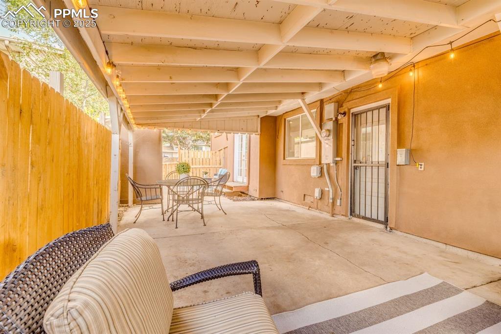 Image 19 of 47: View of covered patio / terrace featuring outdoor dining space