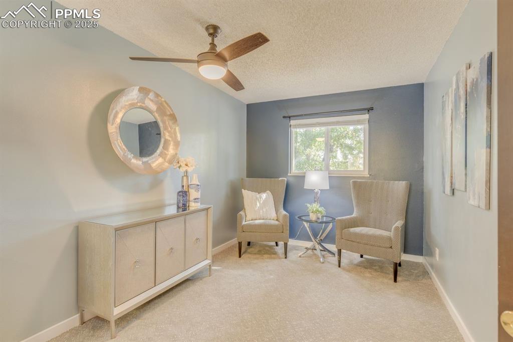 Image 27 of 47: Sitting area in oversized primary bedroom.