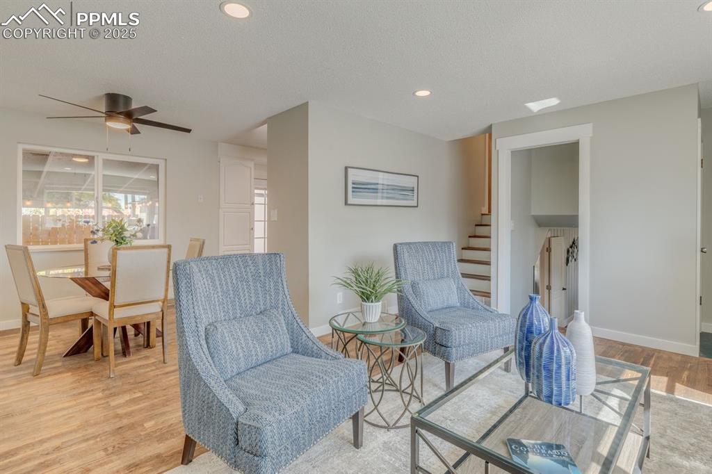 Image 37 of 47: Living room opens up to the dining area.