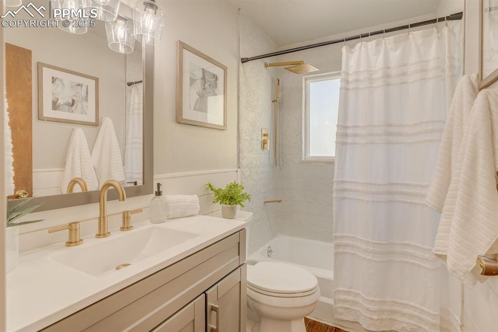 Image 5 of 47: Full bathroom with shower / tub combo.