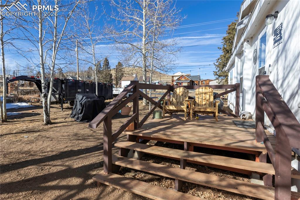 Image 26 of 27: The wooden deck attatched to the home!