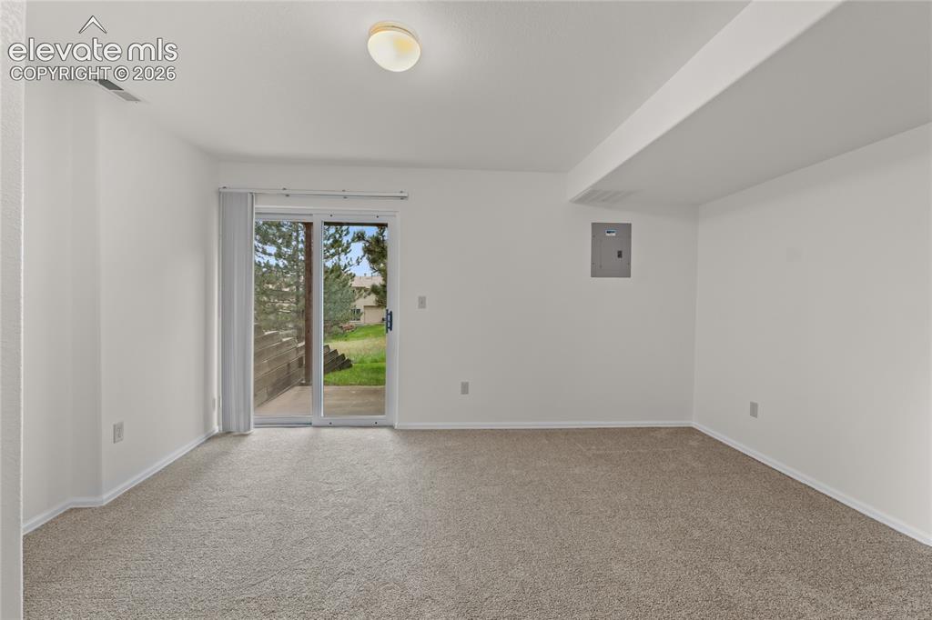 Image 30 of 43: Basement family room with walk out