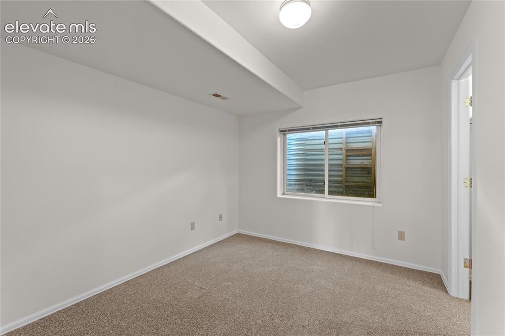 Image 32 of 43: Basement bedroom